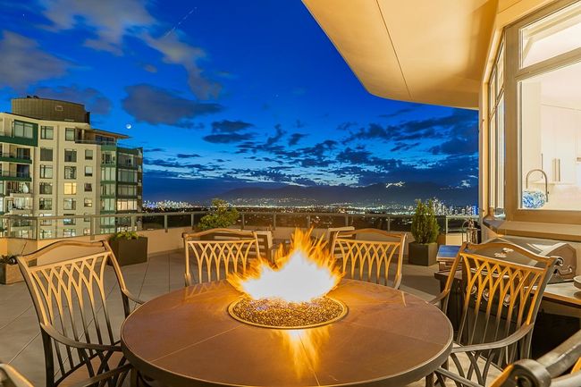 View of patio featuring a fire pit and outdoor dining area | Image 4