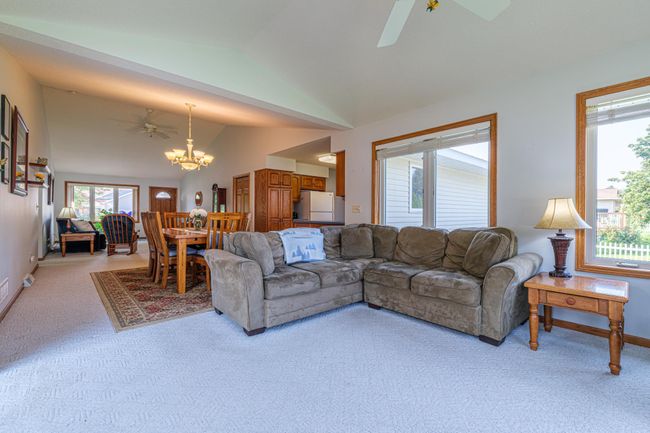 Main floor family room features a patio door to the deck. | Image 8