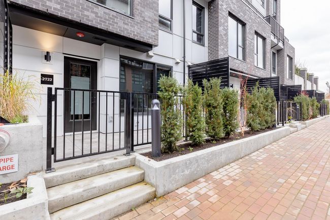 Doorway to property featuring brick siding | Image 7