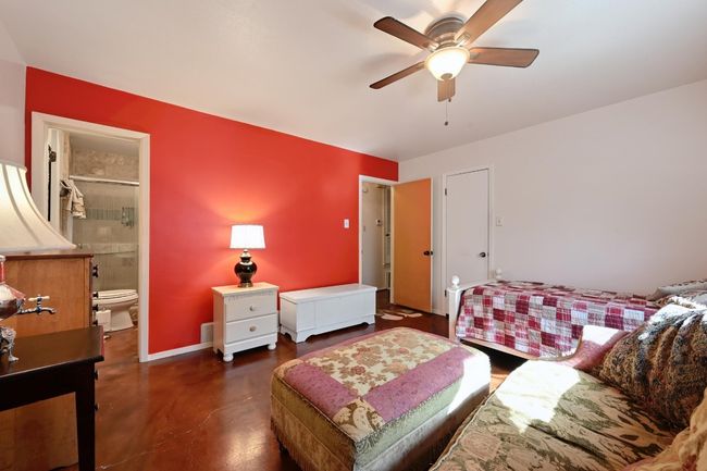 First floor bedroom #1, with a door to the full bathroom, and a walk in closet. | Image 16