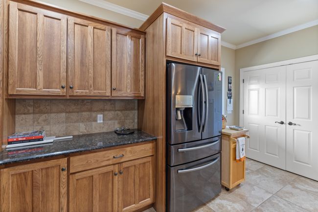 Laundry is located behind the double white doors | Image 19