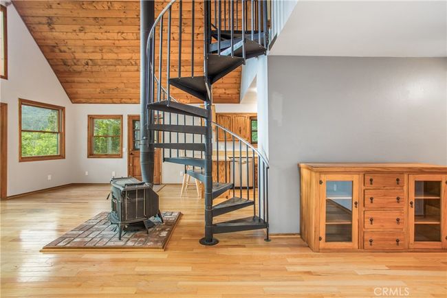 spiral staircase leads up to the primary bedroom | Image 24