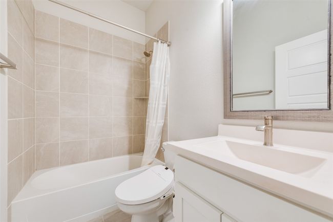 Full bath featuring toilet, shower / tub combo, and vanity | Image 14