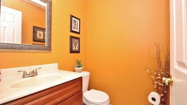 Half bath on first level between foyer and kitchen dinette | Image 6