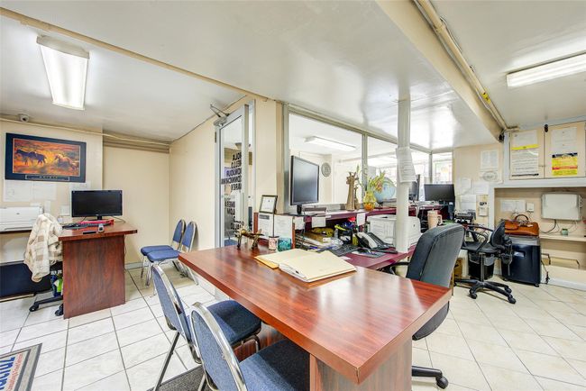 Office area with tile patterned flooring | Image 7