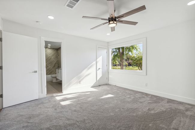 Unfurnished bedroom with recessed lighting, visible vents, ensuite bathroom, and carpet flooring | Image 27