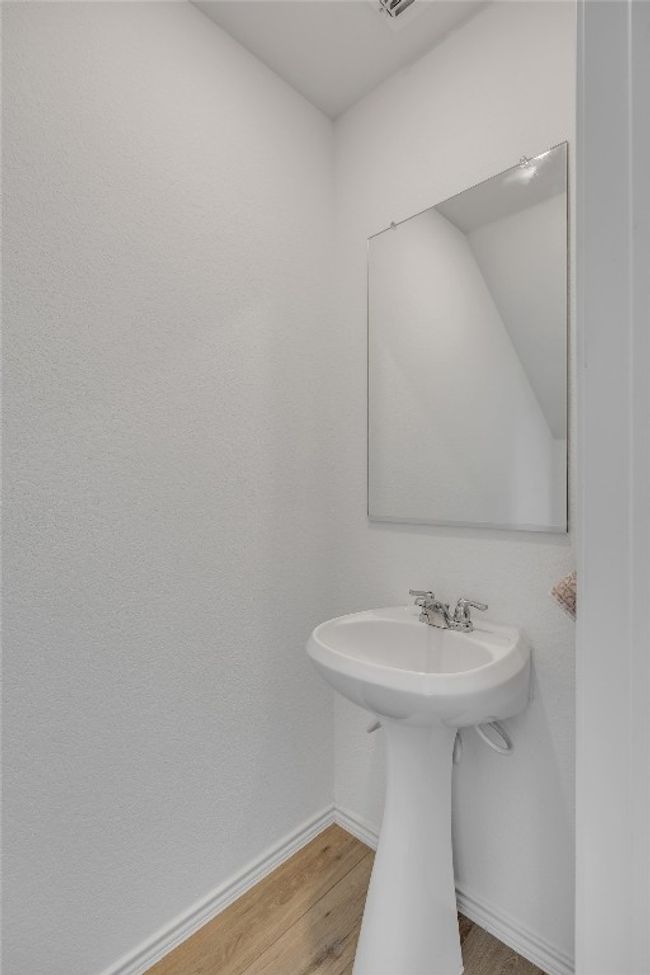 Bathroom with wood finished floors and baseboards | Image 19