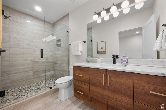 Bathroom featuring vanity, a stall shower, and recessed lighting | Image 64