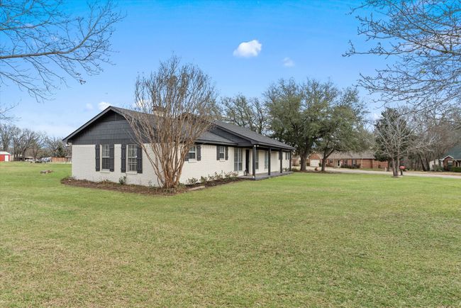 View of side of property with a lawn | Image 27