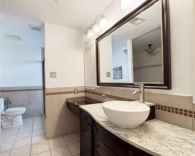 Stylish sink and table in master bathroom | Image 11