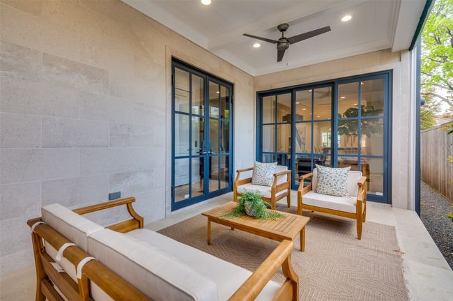 View of patio / terrace featuring outdoor lounge area, fence, ceiling fan, and french doors | Image 25