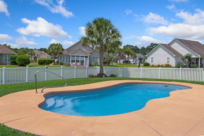 View of swimming pool featuring a residential view and a patio area | Image 18