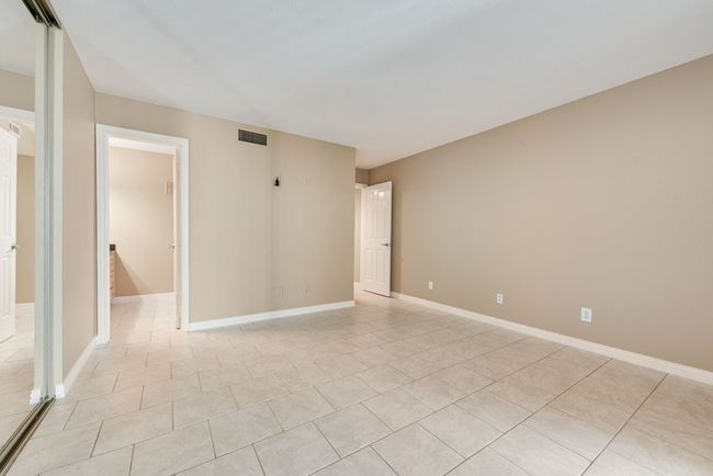 Unfurnished room with light tile patterned floors, baseboards, and visible vents | Image 6