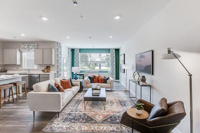 Spacious main level is light & bright with tons of windows and high ceilings. | Image 3