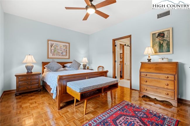 Primary bedroom with doorway leading to the bath and additional closet | Image 5