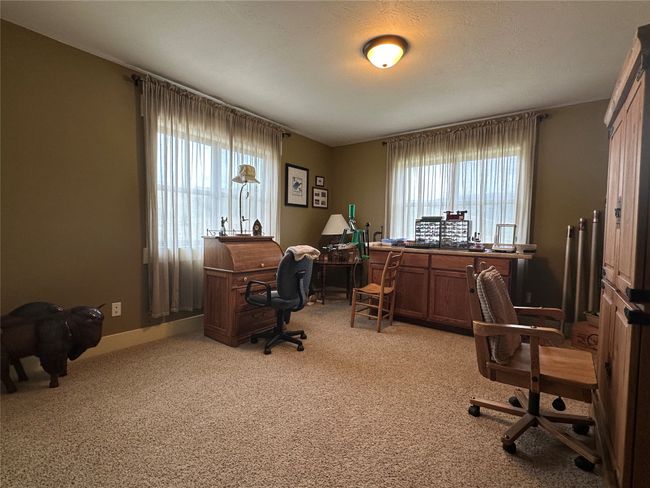 Office featuring healthy amount of natural light and light carpet | Image 21