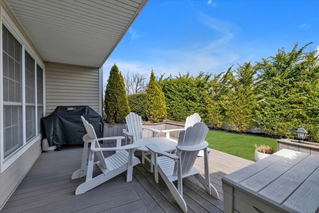 Deck featuring area for grilling and a yard | Image 18