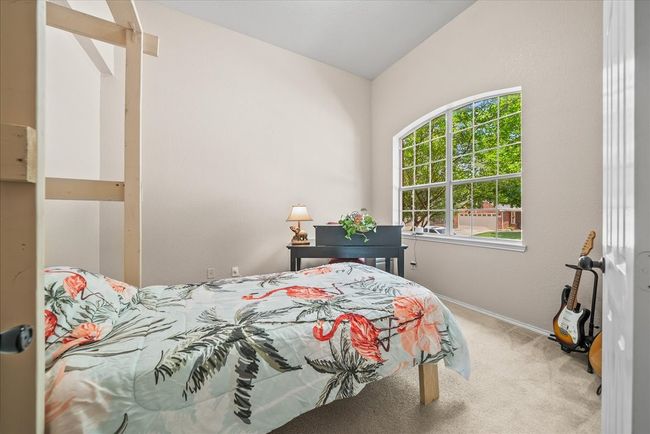 Carpeted bedroom featuring baseboards | Image 9