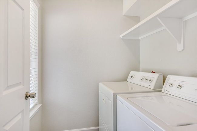 washer/dryer can convey if the buyer wants them. (gas or electric-there's both) Shelving added to laundry for storage/soaps etc, fresh paint and even a doggy door to the backyard! | Image 8
