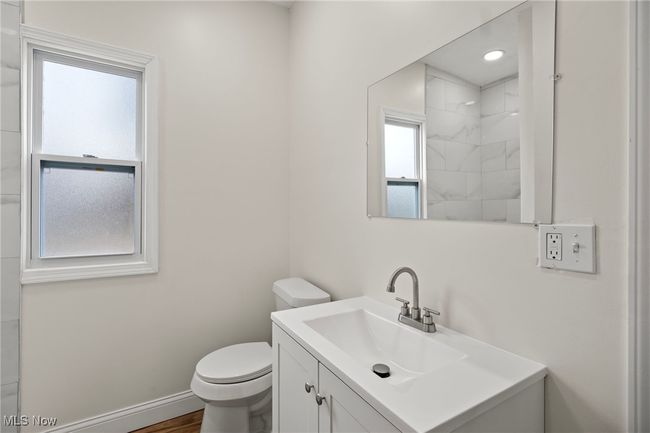 Bathroom with hardwood / wood-style flooring, vanity, and toilet | Image 15