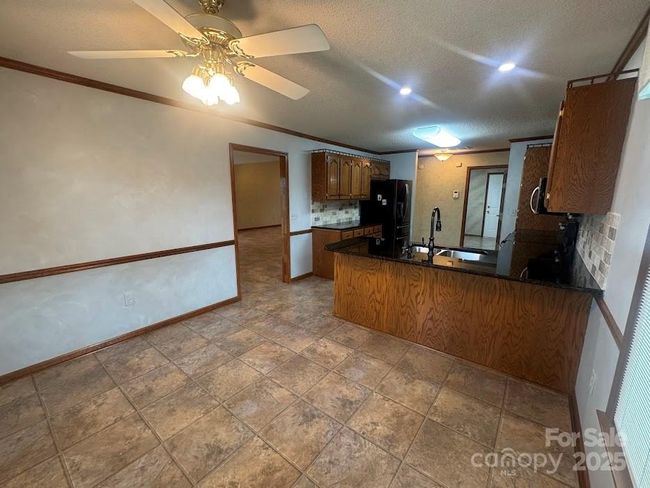 view of breakfast and bar area of kitchen | Image 16