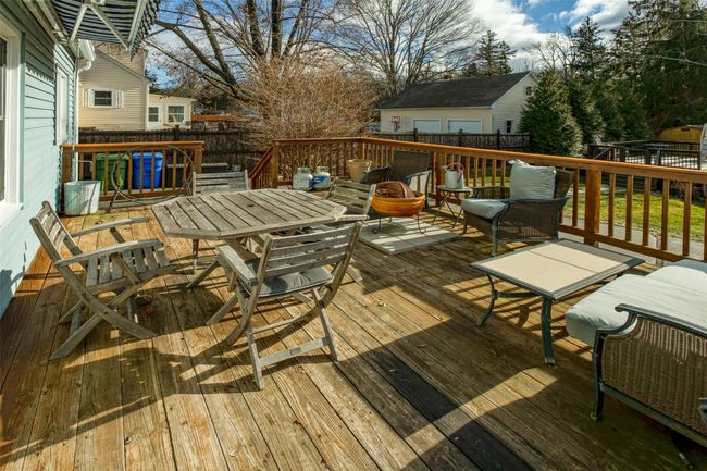 Deck with an outdoor living space | Image 26