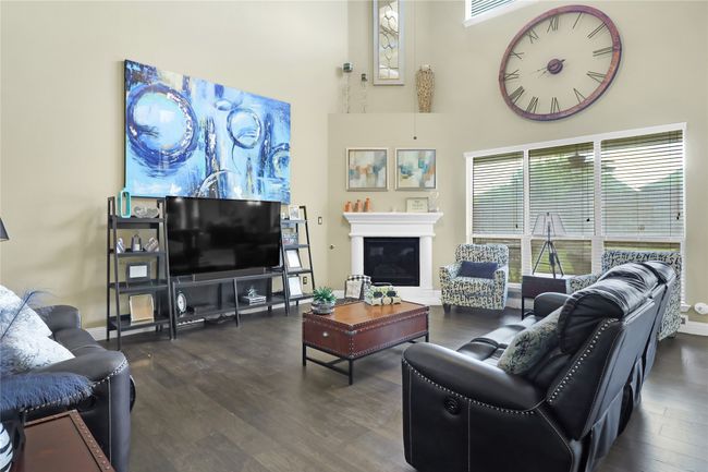 Fireplace in living room. Lower and upper windows for great lighting. | Image 7