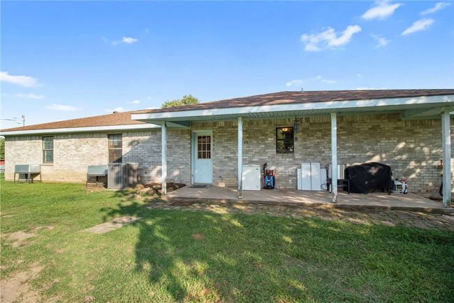 Back of property with a yard, brick siding, and a patio area | Image 30