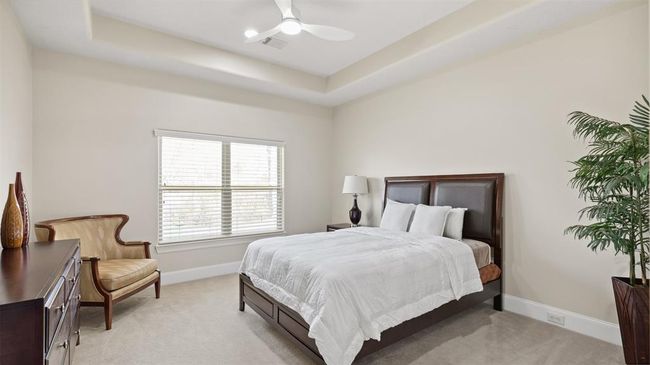 Well lit upstairs bedroom with tray ceilings makes for a nice architectural touch | Image 37