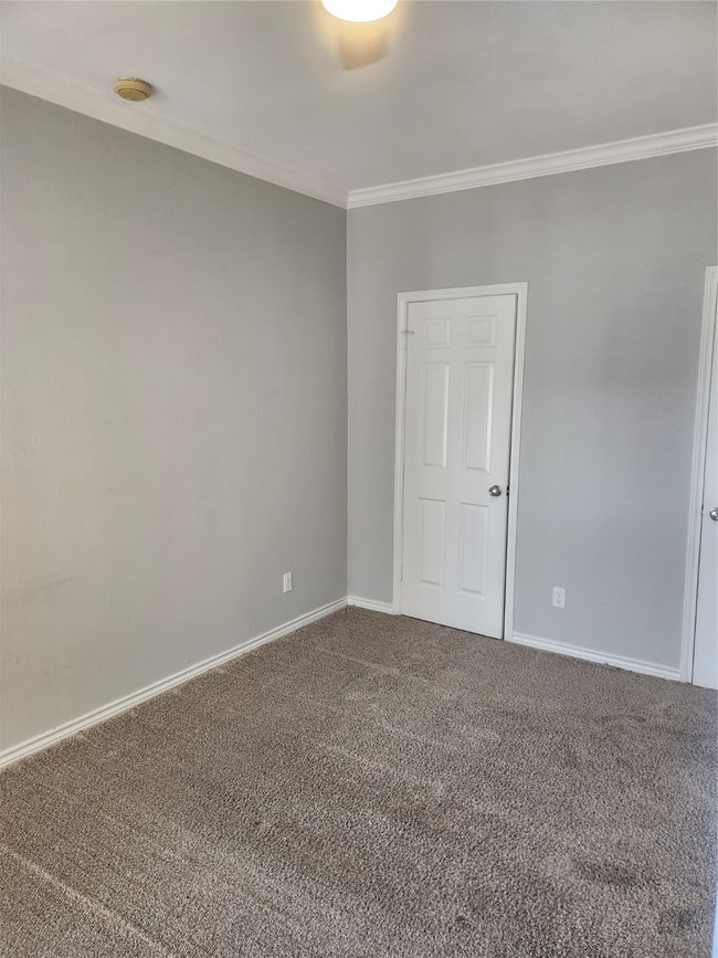 Carpeted diningroom with baseboards and ornamental molding | Image 11