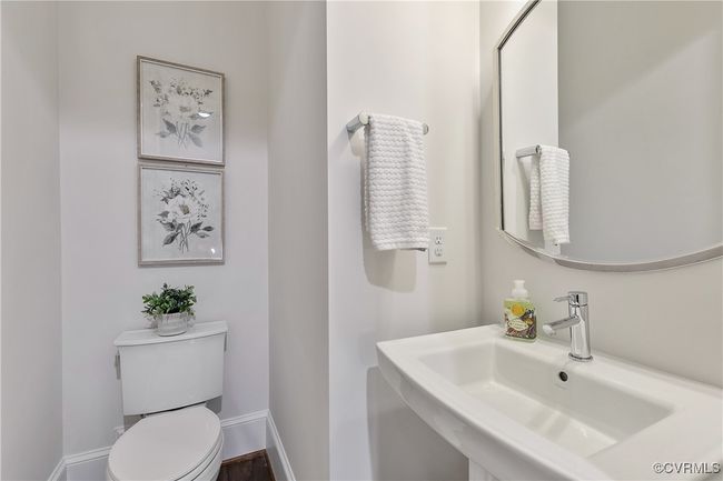 Bathroom with baseboards, a sink, and toilet | Image 16