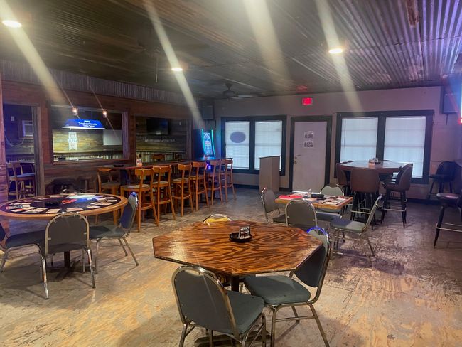 Dining space with a dry bar, a ceiling fan, and concrete floors | Image 10