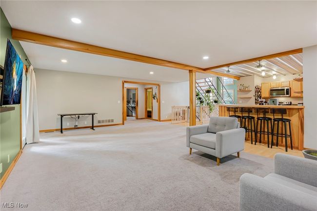 Living area featuring beamed ceiling, light carpet, recessed lighting, and​​‌​​​​‌​​‌‌​‌‌​​​‌‌​​‌‌​‌​​​​​‌ bar | Image 8