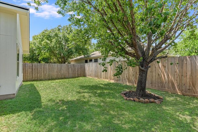 View of backyard. Plenty of room for the pups to run around, featuring a recently installed fence on 2 sides | Image 16