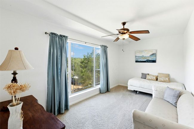 Bedroom featuring carpet floors and a ceiling fan | Image 22