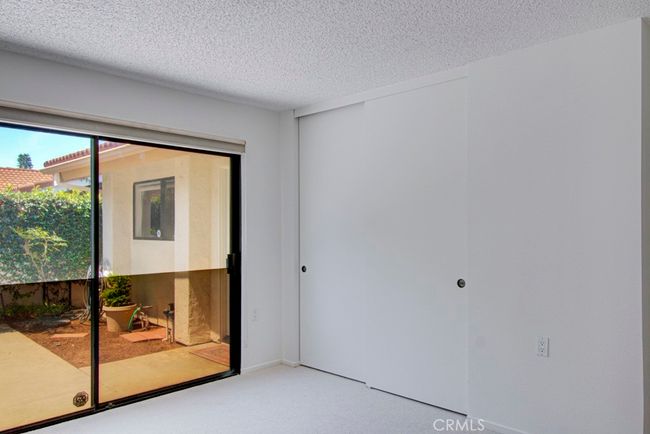 Another view of guest bedroom #1. Either guest bedroom could serve as a home office, workout room, arts and crafts studio or TV room. | Image 24