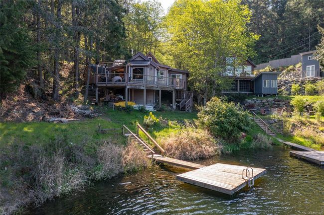 View of dock featuring a deck with water view and stairs | Image 40