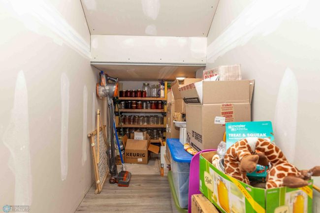 Under the stairs storage, sump pump location. | Image 9