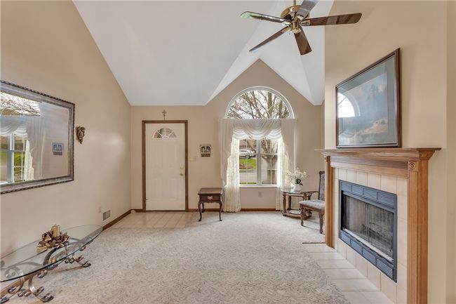 Ceiling Fan and Charming Arched Feature Window in the Living Room. | Image 7