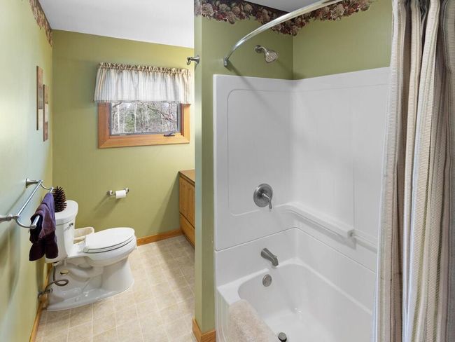 The upper-level full bath has seen some updates over the years. | Image 46