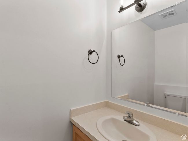 Bathroom with vanity and toilet | Image 16