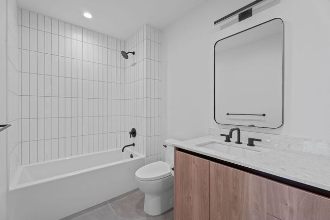 Bathroom with vanity and shower / tub combination | Image 22