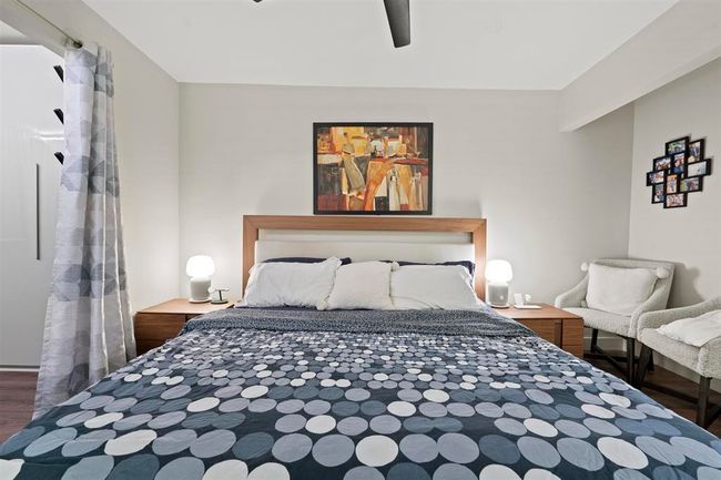 Bedroom featuring wood finished floors and a ceiling fan | Image 8