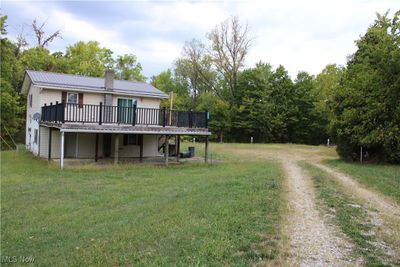 View of yard with a wooden deck | Image 2