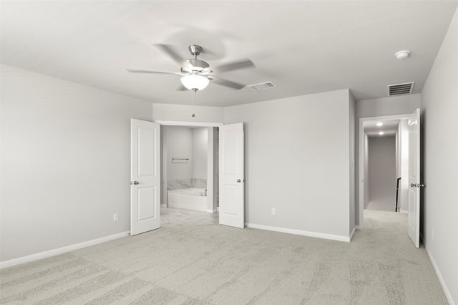 Unfurnished bedroom with baseboards, light carpet, and ceiling fan | Image 20