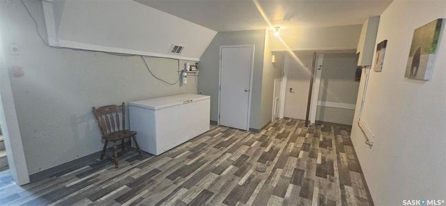 Laundry room featuring wood finished floors | Image 24