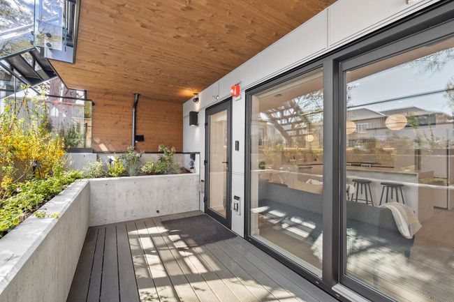 Exterior space with wooden ceiling, wooden walls, and wood-type flooring | Image 22