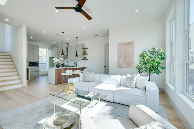 Living room featuring light hardwood / wood-style floors, ceiling fan, and sink | Image 13