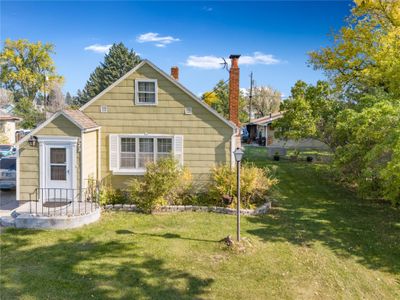 Back of house with a lawn | Image 2