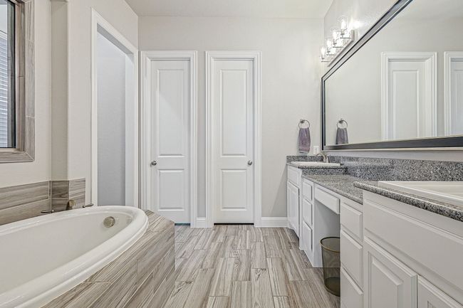 Primary Bath offers luxurious elements like soaking tub, dual sinks, walk in shower and loads of storage! | Image 17